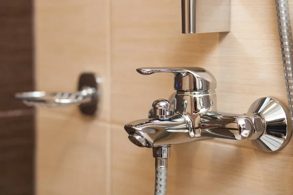 Metal-colored mixer for a shower — Stock Photo, Image