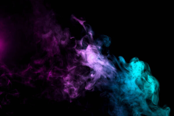 Cloud of smoke of purple, green on a black isolated background. Background from the smoke of wipe