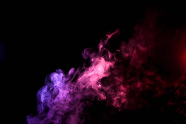 Cloud of smoke of purple, pink on a black isolated background. Background from the smoke of wipe