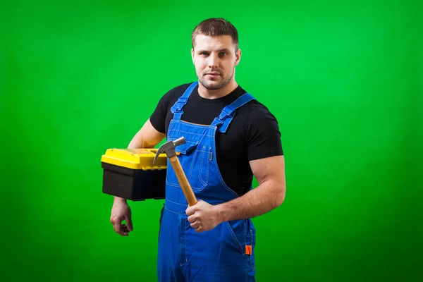 Trabalhador Construção Masculino Cabelos Escuros Uma Camiseta Preta Construção Azul — Fotografia de Stock