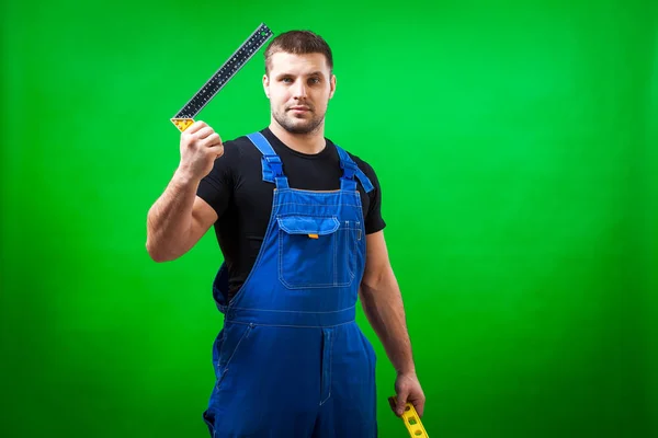 Trabalhador Construção Masculino Cabelos Escuros Uma Camiseta Preta Construção Azul — Fotografia de Stock