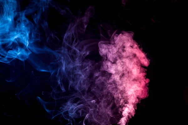 Colorful  red and blue smoke clouds on dark background. Background of smoke vape