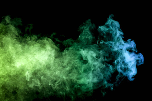 Cloud of smoke of blue and green colors on black isolated background. Background from the smoke of vape