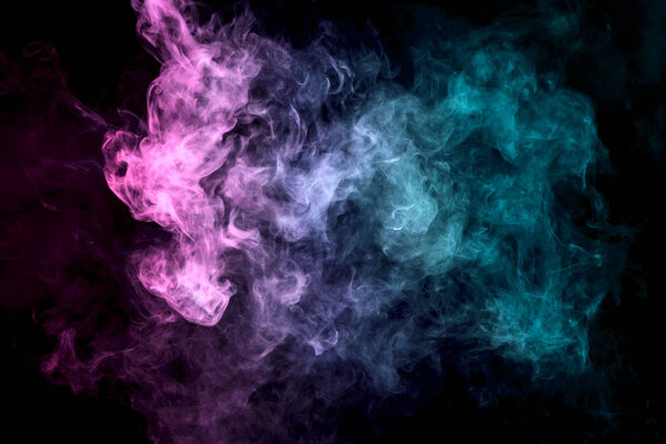 Cloud of smoke of purple, red and blue colors on black isolated background. Background from the smoke of vape