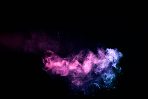 Colorful smoke of blue, pink on a black isolated background. Background from the smoke of vape
