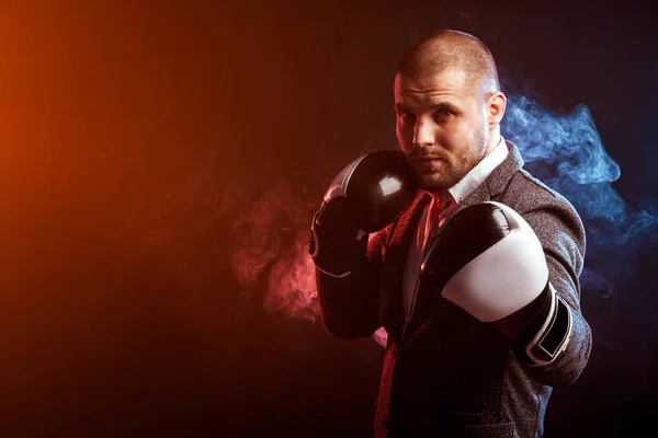 man businessman in gray suit and boxing gloves