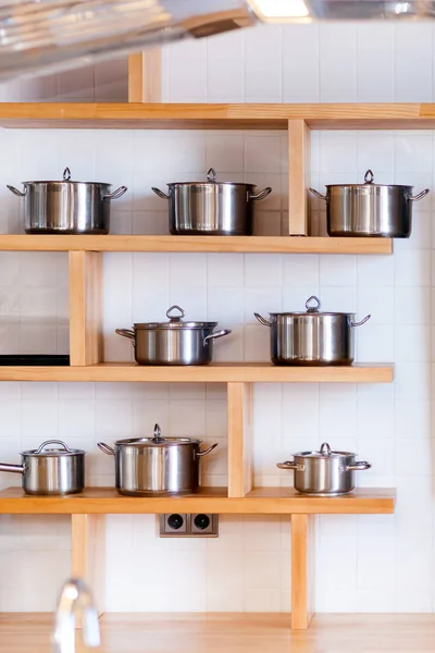 Beautiful Modern Mettalic New Pans Different Sizes Stand Wooden Shelves — Stock Photo, Image