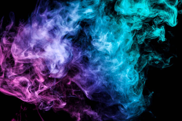 Colorful smoke of blue, pink, purple on a black isolated background. Background from the smoke of vape