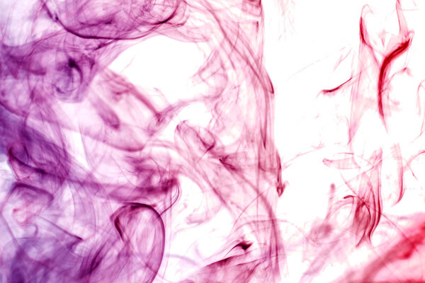 Colorful smoke of pink, purple on a white isolated background. Background from the smoke of vape