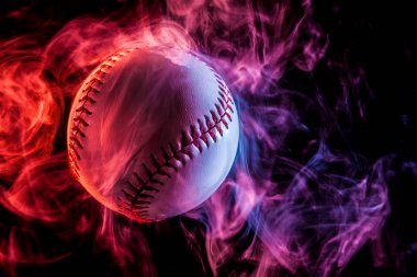 White baseball ball in multi-colored red smoke from a wipe on a black isolated background clipart