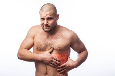 Injury of the rib. Young bald man sportive physique holds on sore rib isolated on white isolated background. Fracture of rib clipart