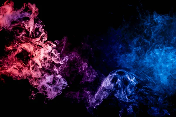 Pink and blue cloud of smoke of  black isolated background. Background from the smoke of vape