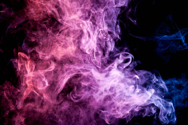 Pink and purple cloud of smoke of black isolated background. Background from the smoke of vape