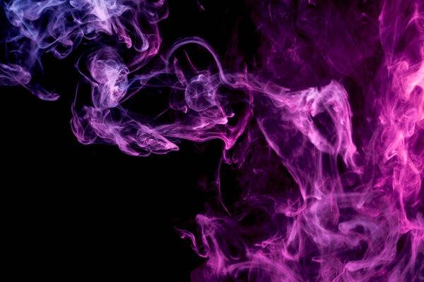 Pink and purple cloud of smoke of black isolated background. Background from the smoke of vape