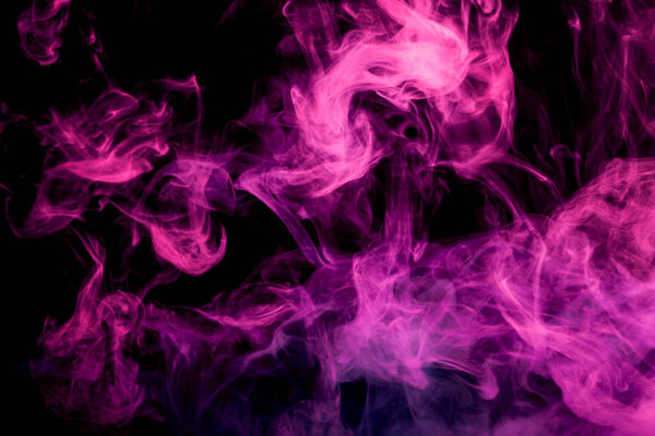 Thick colorful smoke of purple and pink on a black isolated background. Background from the smoke of vapee