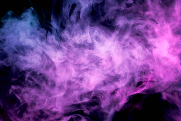 Thick pink colorful smoke on a black isolated background. Background from the smoke of vape