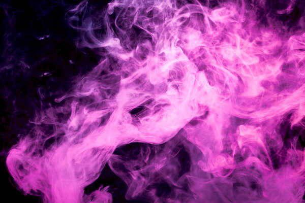 Thick pink colorful smoke on a black isolated background. Background from the smoke of vape