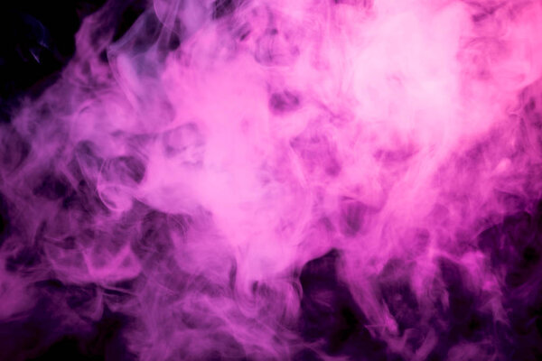 Pink cloud of smoke of black isolated background. Background from the smoke of vape