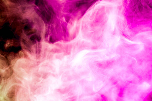 Colorful pink smoke on a black isolated background. Background from the smoke of vape