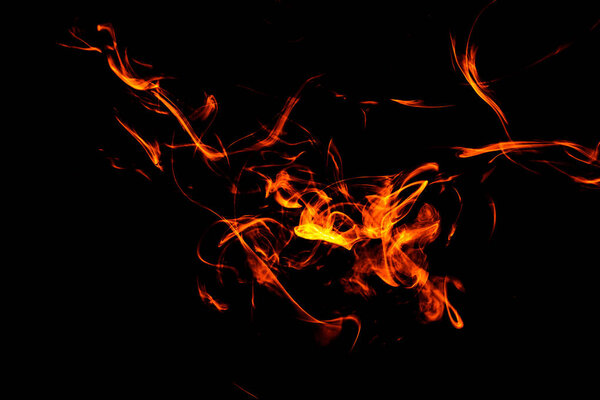 Fire flames background. Dense fiery smoke on a black isolated background. Background of smoke vape
