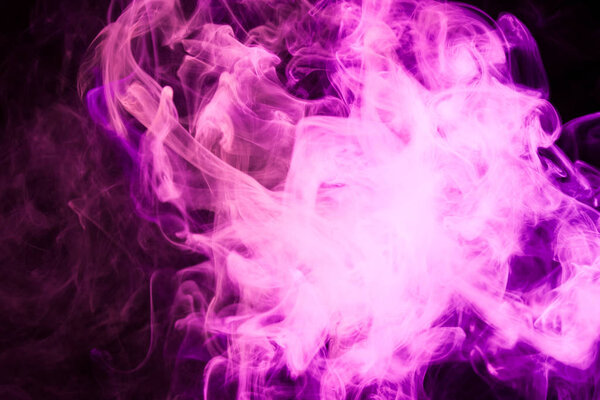 Pink and red smoke on black background