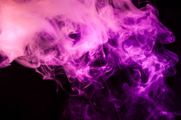 Pink cloud of smoke of black isolated background. Background from the smoke of vape
