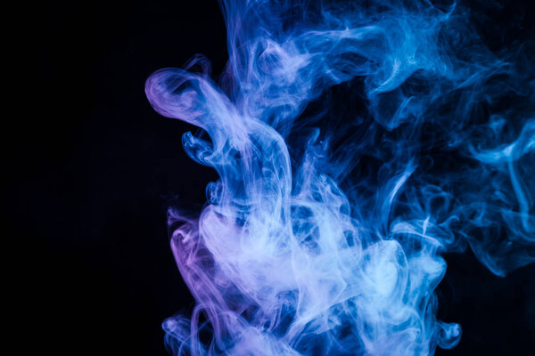 Blue cloud of smoke of black isolated background. Background from the smoke of vape