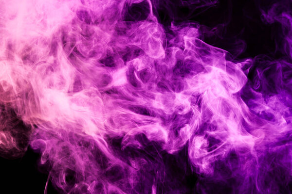 Colorful pink and red smoke on a black isolated background. Background from the smoke of vape