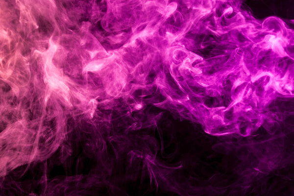 Dense multicolored pink and red smoke on a black isolated background. Background of smoke vape
