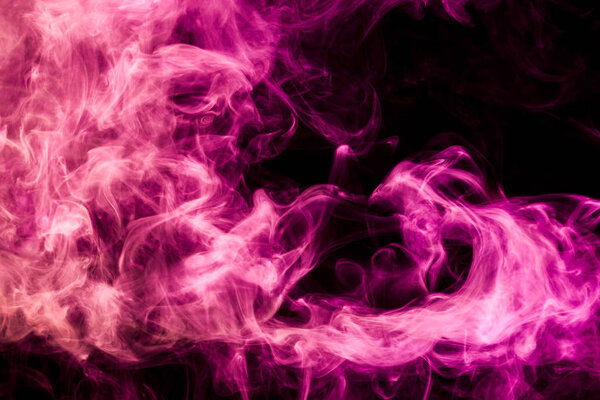 Pink and red cloud of smoke of black isolated background. Background from the smoke of vape