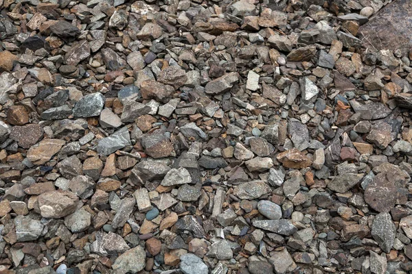 Close-up of gray small stones near the river