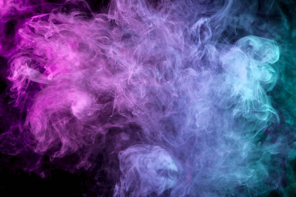 Purple, pink and blue smoke on black backgroun