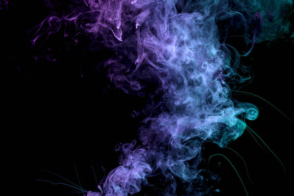 Blue and purple smoke on black backgroun