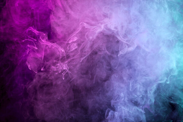 Pink, blue and purple cloud of smoke of white isolated background. Background from the smoke of vape