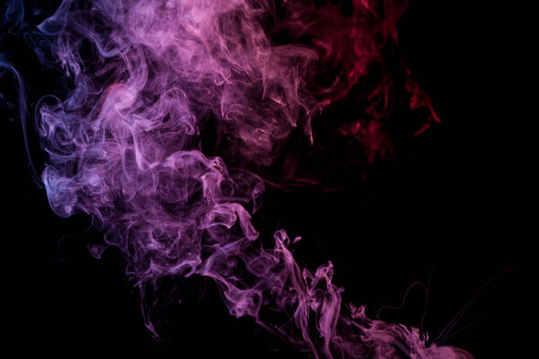 Pink and purple cloud of smoke of black isolated background. Background from the smoke of vap