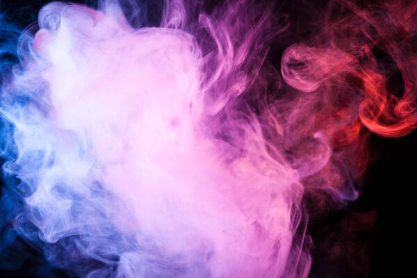 Pink, purple, orange and blue smoke on black background