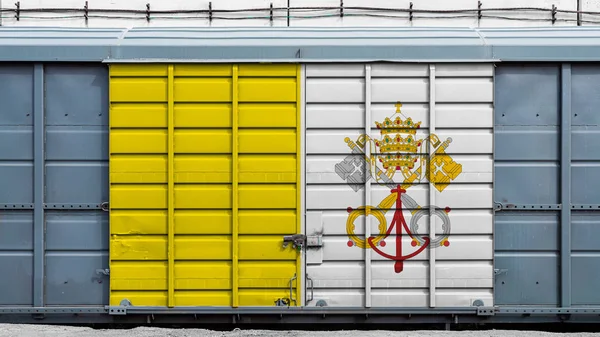 Front view of a container train freight car with a large metal lock with the national flag of Vatican.The concept of export-import,transportation, national delivery of goods and rail transportation