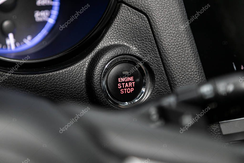 Novosibirsk, Russia  September 29, 2019:  Subaru Outback , Detail on a black start stop engine  button in a car.Car detailing.