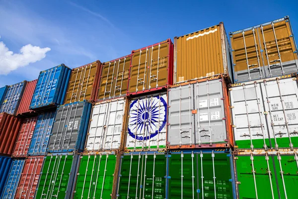 The national flag of India on a large number of metal containers for storing goods stacked in rows on top of each other. Conception of storage of goods by importers, exporters