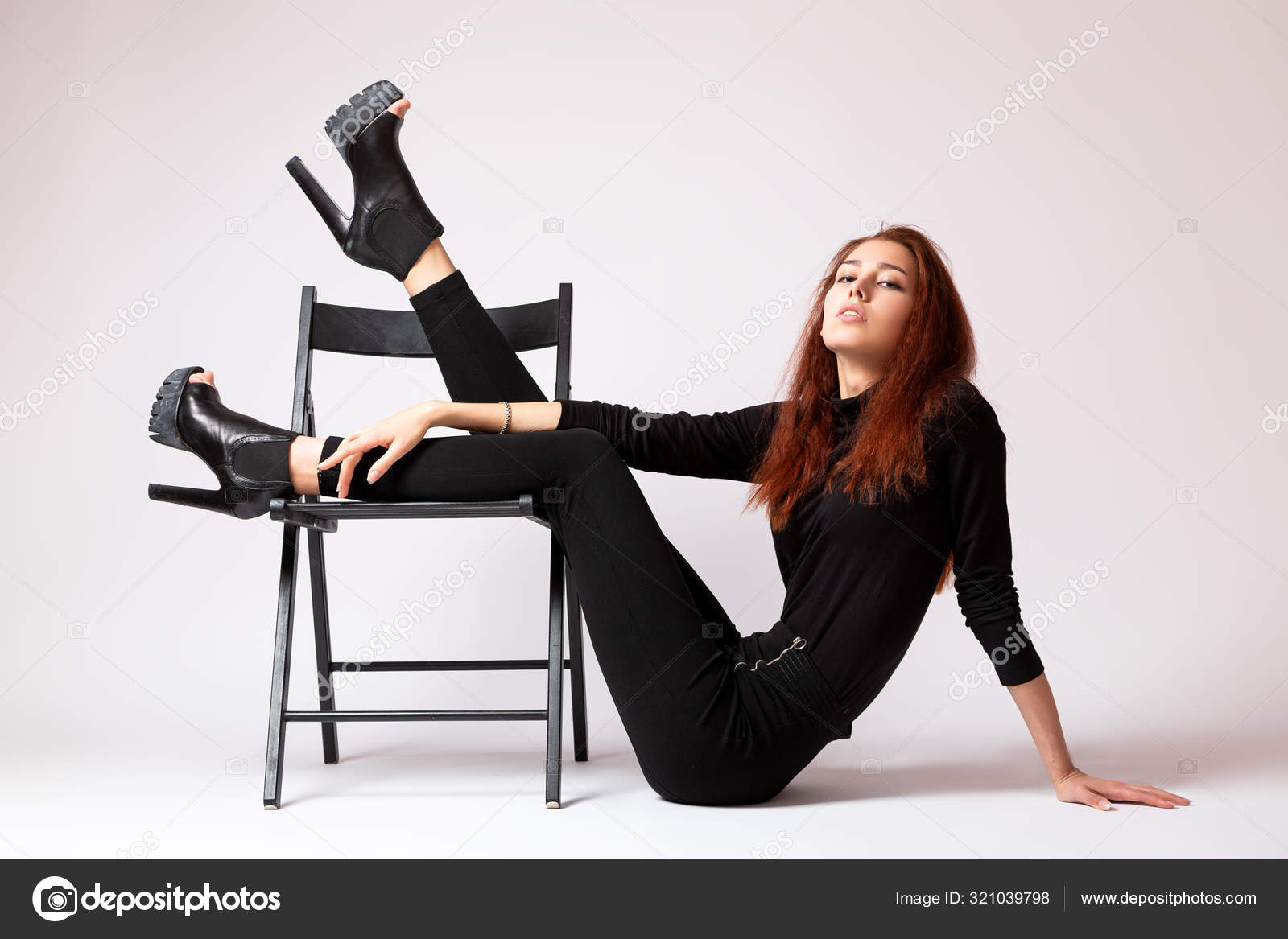Download this stock image: Portrait beautiful woman with attitude sitting  on a chair wearing blac… | Sitting poses, Sitting pose reference, Studio photography  poses