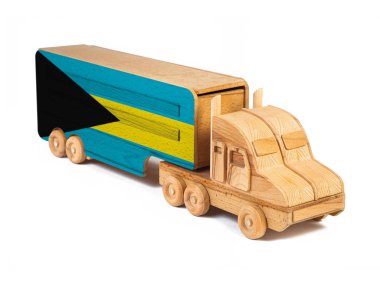 Ulusal bayrağı boyanmış tahta bir oyuncak kamyonun yakın çekimi. İhracat-ithalat, ulaşım, malların ulusal teslimatı 