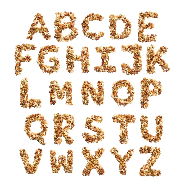 英文字母表 由榛子 南瓜籽混合而成 背景白色孤立 用坚果做的食物 商店的明亮字母表 — 图库照片