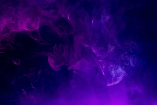 . Transparent creativity. Abstract art colored smoke on black isolated background. Stop the movement of multicolored smoke on dark backgroun