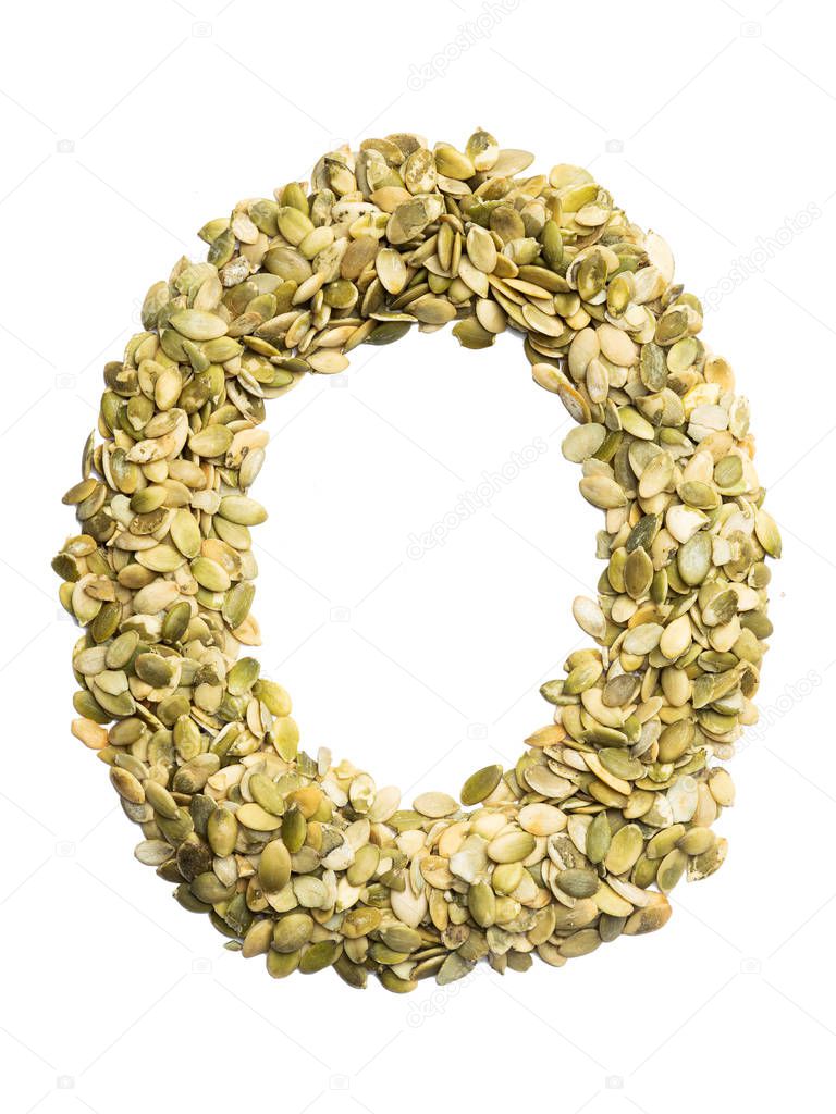 Letter O of the English alphabet from pumpkin seeds on a white isolated background. Food pattern made from seeds. Bright alphabet for shops. 