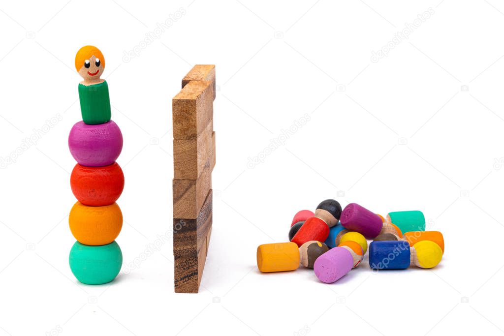 Wooden eco-toys, separated by a huge wall: on the one hand, one man is trying to get over, and on the other, a large crowd. The concept of dividing people by the big wall
