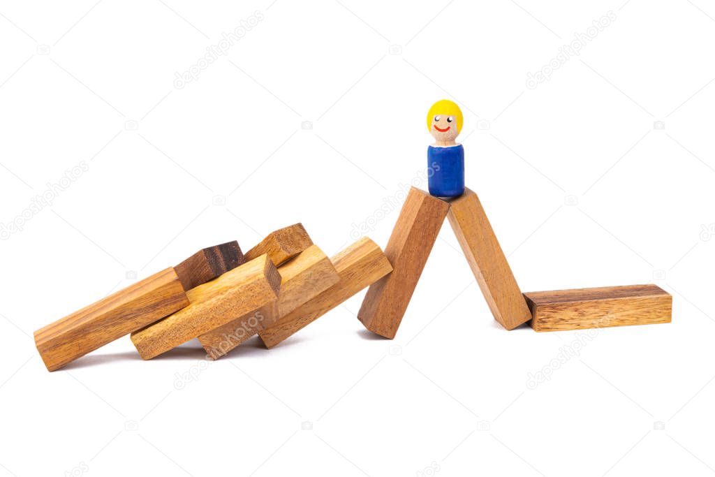 a small wooden toy a boy stands on a large number of wooden chippers on a white isolated background
