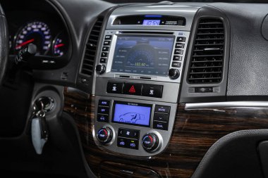 Novosibirsk, Russia  October 23, 2019:  Hyundai Santa Fe, close-up of the dashboard, monitor with music and radio , adjustment of the blower, air conditioner, player. modern car interior clipart