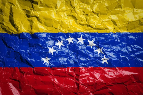 National flag of Venezuela on crumpled paper. Flag printed on a sheet. Flag image for design on flyers, advertising.