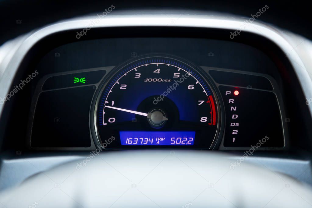 Close up Instrument automobile panel with Odometer, speedometer, tachometer, fuel leve