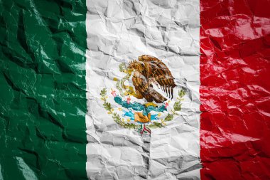 Buruşmuş kağıt üzerinde Meksika bayrağı. Çarşafa bayrak basılmış. Broşürlerde ve reklamlarda tasarım için bayrak resmi.